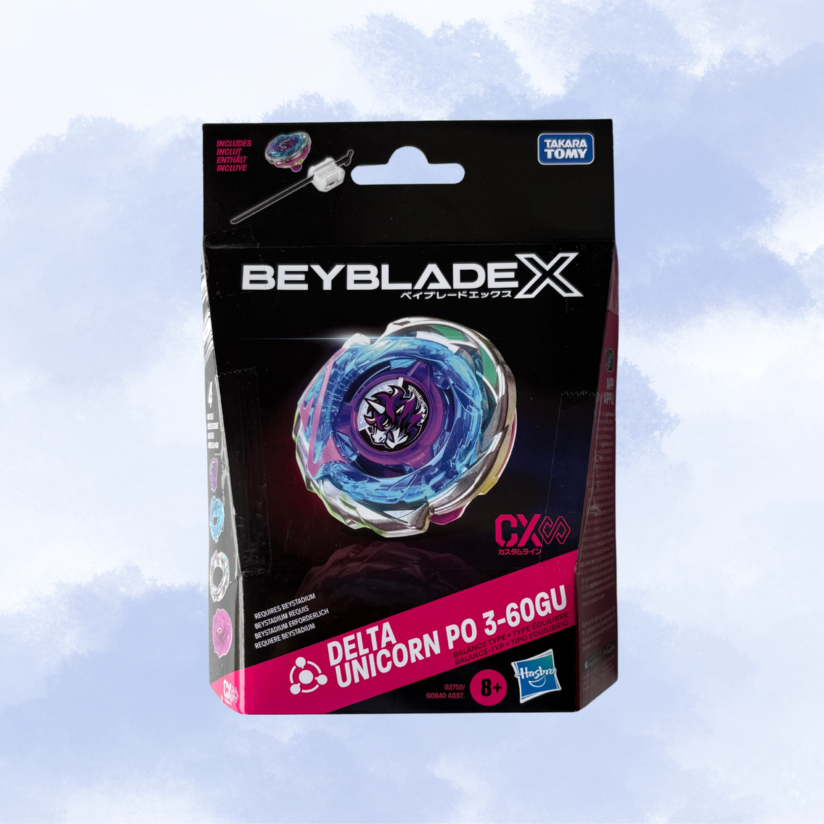 Beyblade X Delta Unicorn PO 3-60GU toy packaging by Hasbro, featuring a black and pink box with a graphic of the blue and purple spinning top against a light blue cloudy background.
