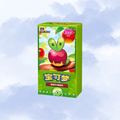A green Pokémon-branded product box featuring Applin on the front on a green box, shown against a soft blue cloudy background.